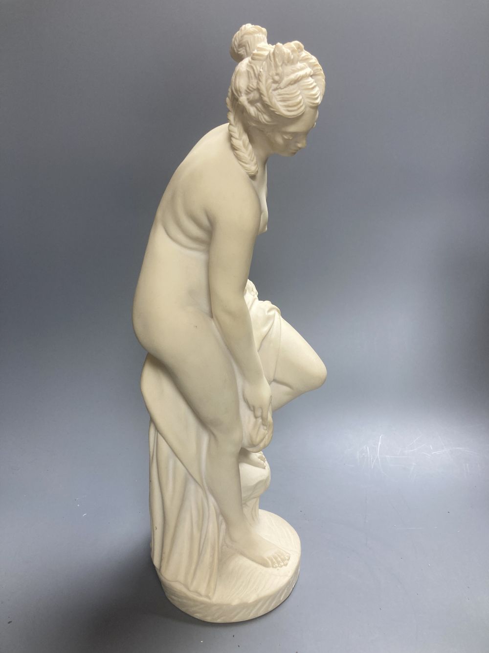 A Copeland Parian figure of a winged maiden and a later composition figure of Venus bathing, H 43cm